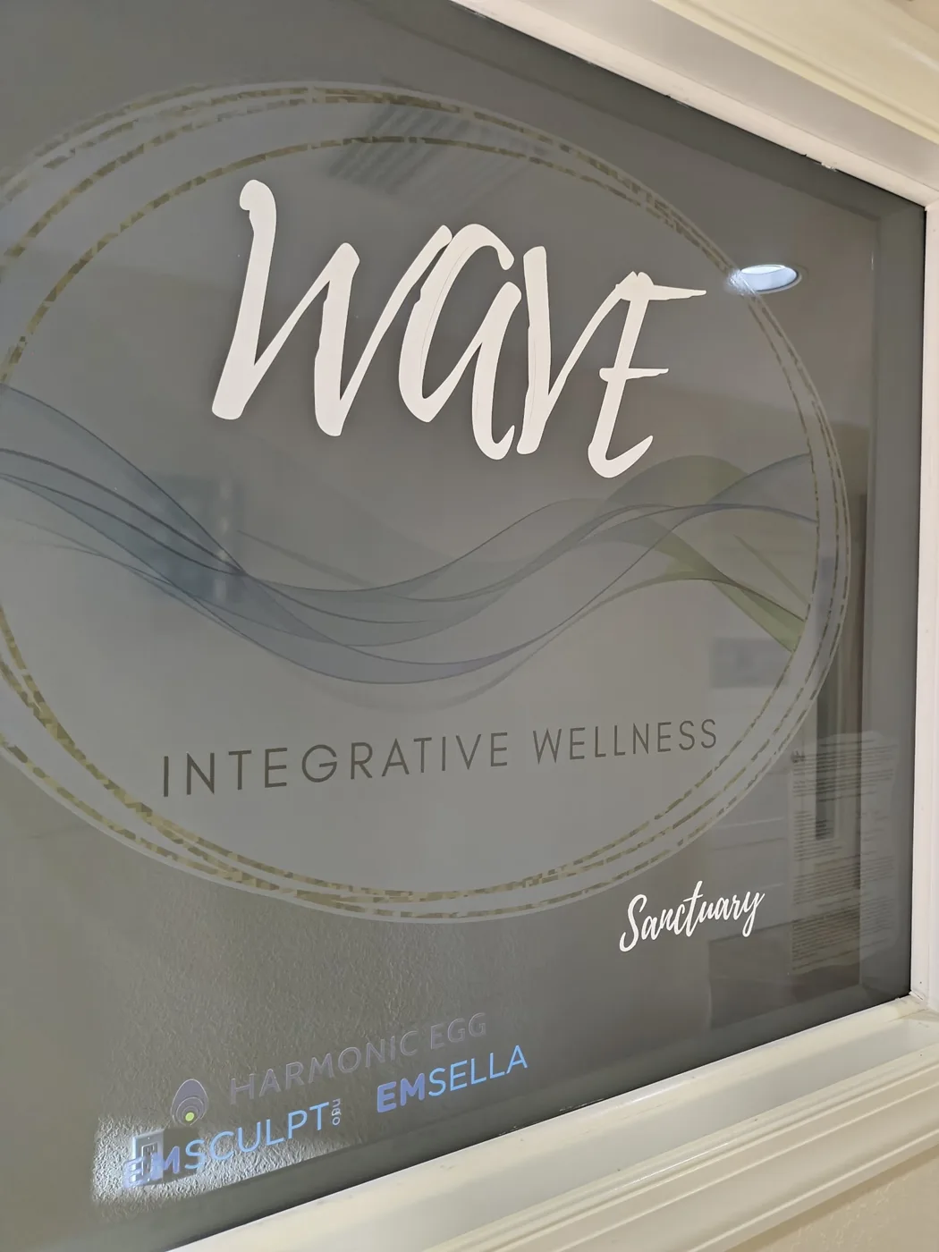 Frosted glass WAVE Integrative Wellness logo window